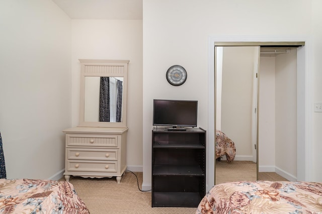 carpeted bedroom featuring a closet