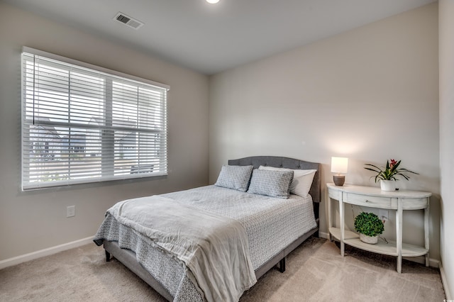 bedroom featuring light colored carpet