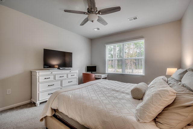 bedroom with ceiling fan and light carpet