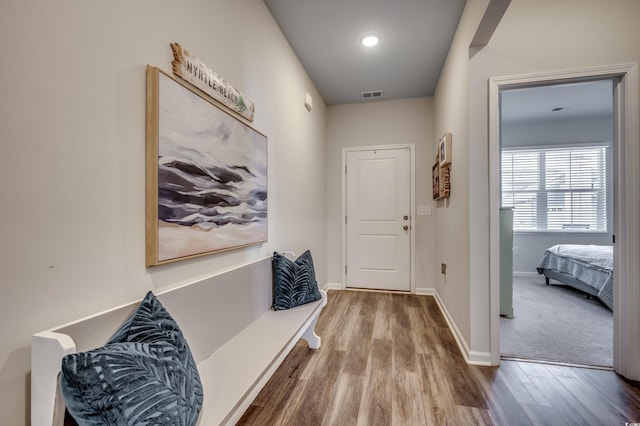 corridor featuring hardwood / wood-style flooring