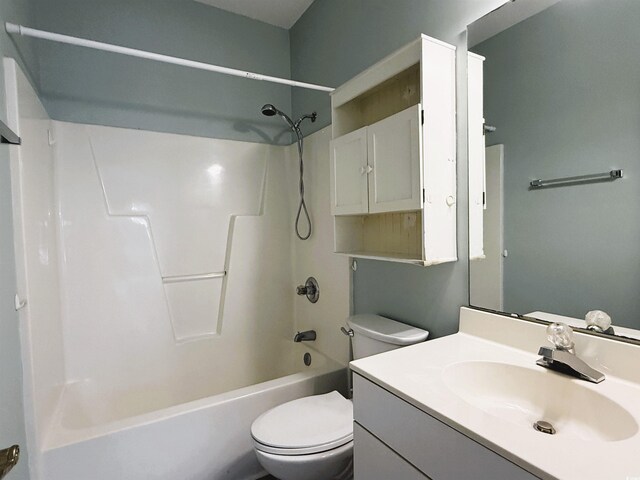 full bathroom with bathtub / shower combination, vanity, and toilet