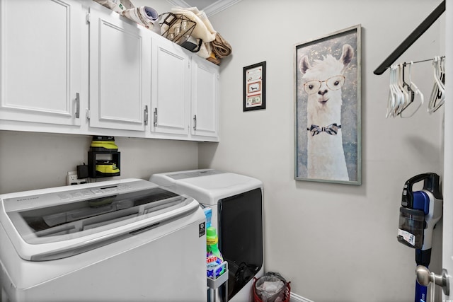 laundry area with cabinets, independent washer and dryer, and ornamental molding