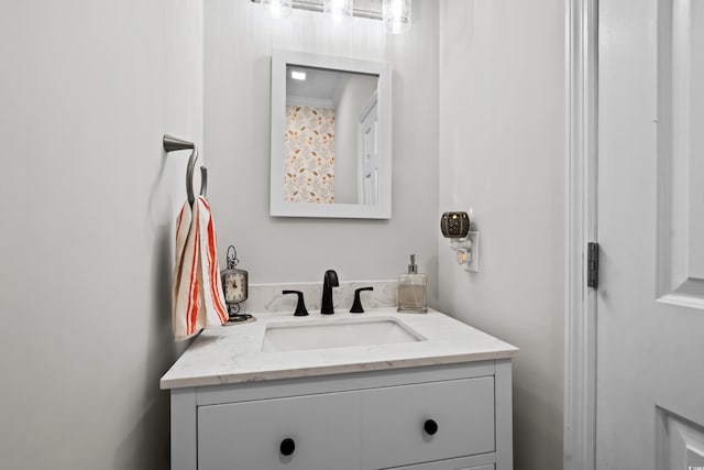 bathroom featuring vanity and ornamental molding