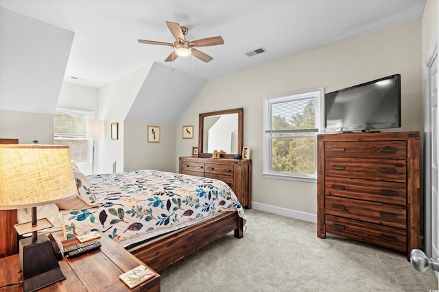 bedroom with light carpet, vaulted ceiling, and ceiling fan