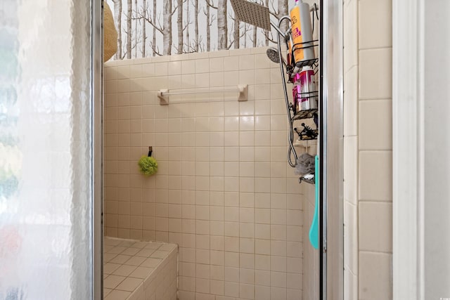 bathroom with a tile shower