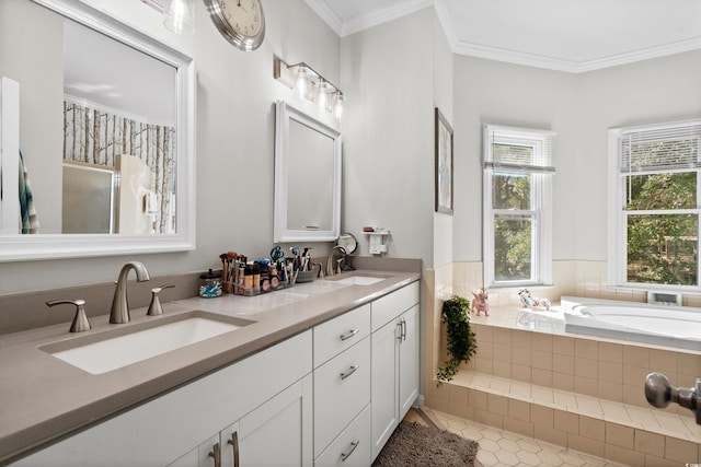 bathroom featuring tile patterned flooring, vanity, a relaxing tiled tub, and crown molding