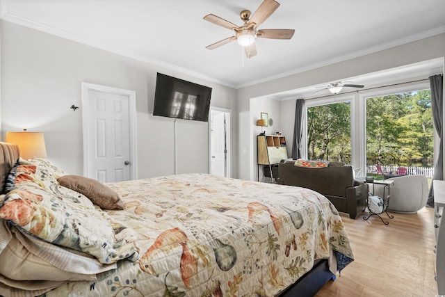 bedroom featuring ceiling fan, ornamental molding, and light wood-type flooring