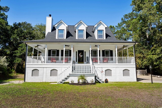 view of front facade featuring covered porch and a front yard