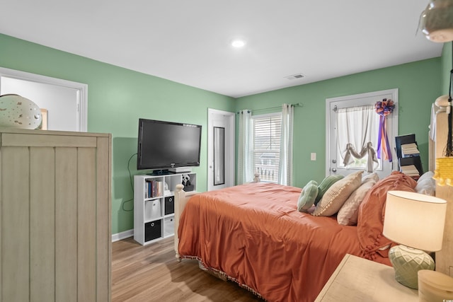 bedroom featuring light hardwood / wood-style floors