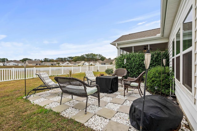 view of patio / terrace featuring a sunroom and area for grilling