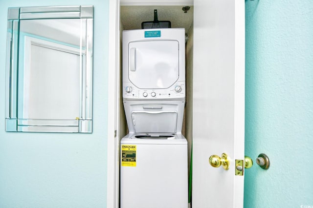 laundry room with stacked washer / dryer