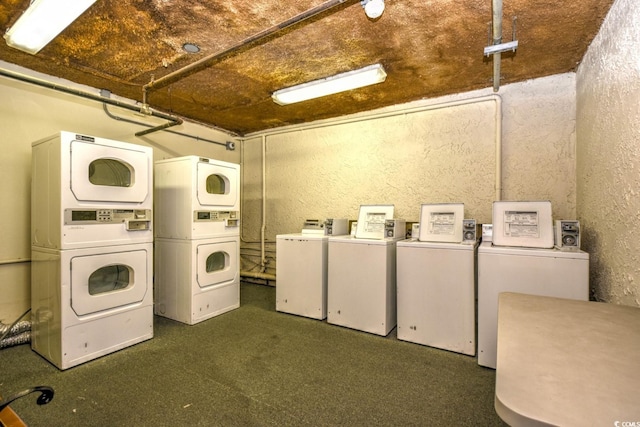 washroom with stacked washer and dryer and washer and clothes dryer