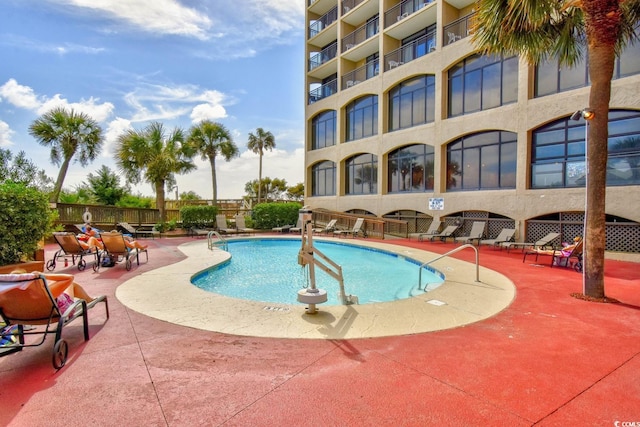 view of pool featuring a patio