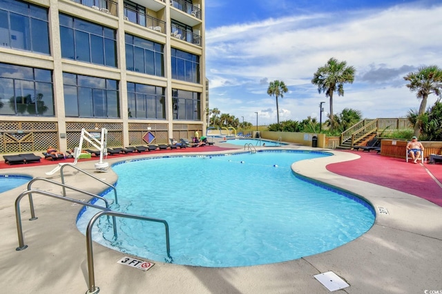 view of pool featuring a patio area