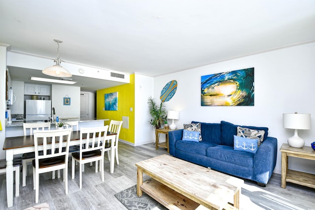 living room with light hardwood / wood-style flooring