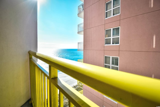 balcony featuring a water view