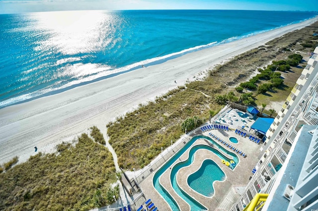 bird's eye view with a view of the beach and a water view