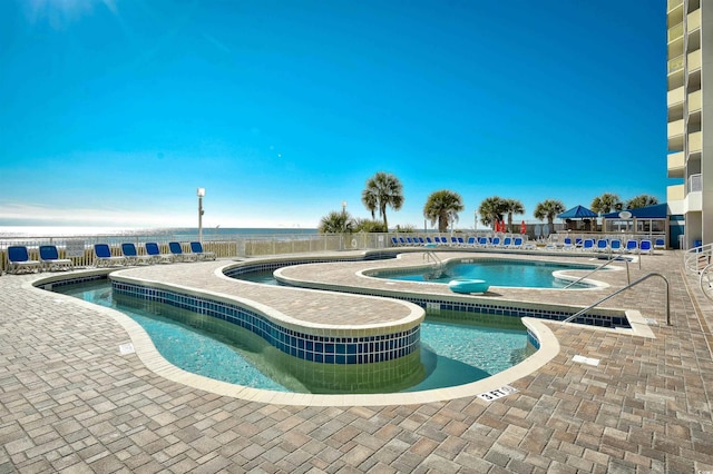 view of pool featuring a patio