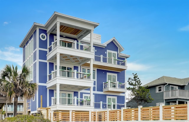 view of front of home featuring a balcony