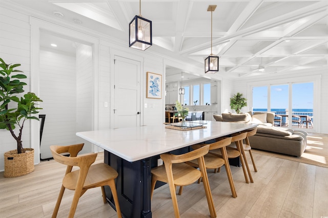 219 S Seaside Dr, Surfside Beach, SC 29575 - dining area featuring light wood-style floors, coffered ceiling, beamed ceiling, crown molding, and recessed lighting