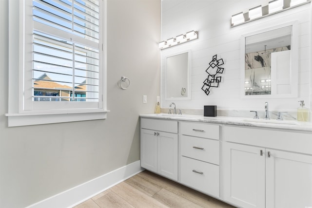219 S Seaside Dr, Surfside Beach, SC 29575 - bathroom with double vanity, plenty of natural light, a shower, and wood finished floors