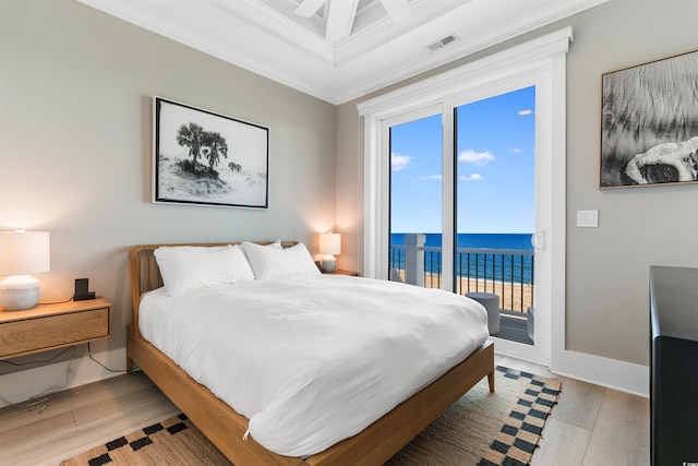 219 S Seaside Dr, Surfside Beach, SC 29575 - bedroom featuring ornamental molding, access to outside, light wood-style floors, a water view, and coffered ceiling