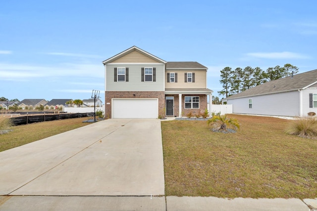 view of front of home featuring a front yard and a garage