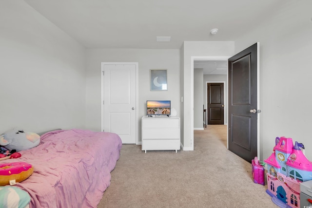 bedroom featuring light carpet