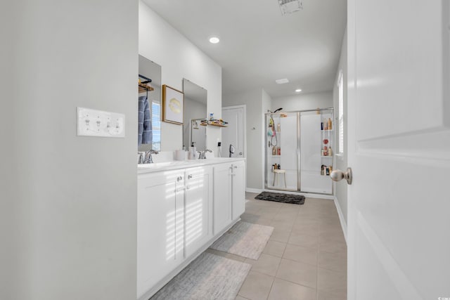 bathroom with vanity, tile patterned floors, and a shower with shower door