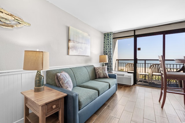 living room featuring hardwood / wood-style floors and a water view