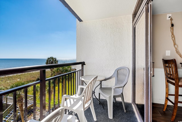 balcony featuring a water view