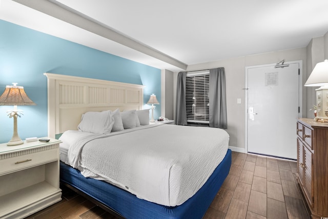 bedroom featuring dark hardwood / wood-style flooring