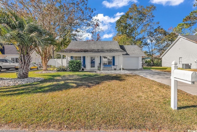 ranch-style home with central AC, covered porch, a front yard, and a garage