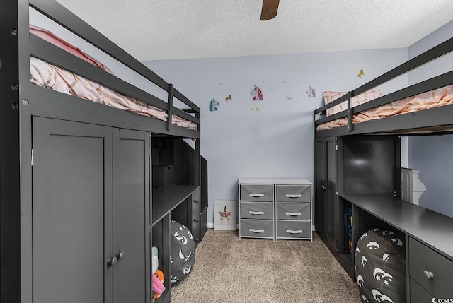 unfurnished bedroom featuring ceiling fan and a textured ceiling