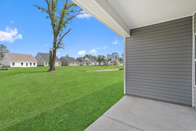 view of yard with a patio and a residential view
