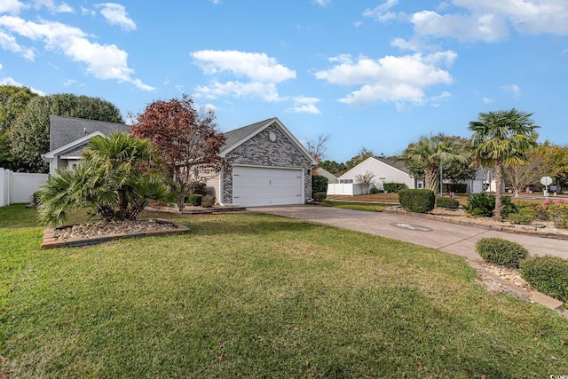 view of front of property featuring a front lawn and a garage