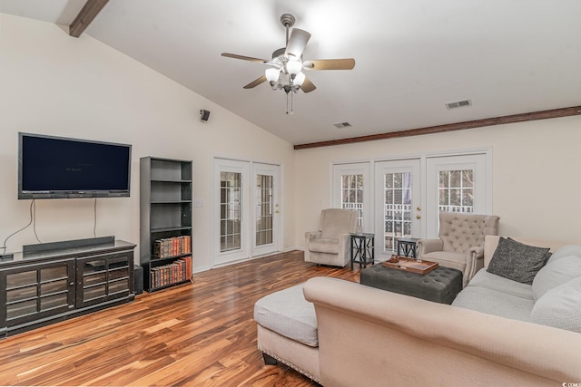 living room with french doors, hardwood / wood-style floors, lofted ceiling with beams, and ceiling fan