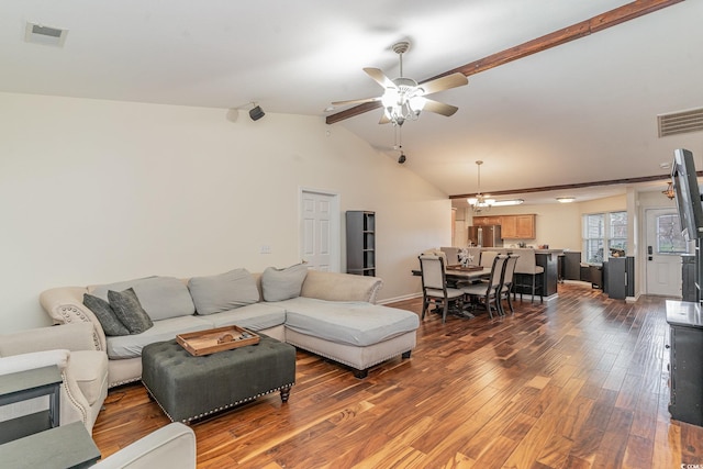 living room featuring vaulted ceiling with beams, ceiling fan with notable chandelier, and wood-type flooring