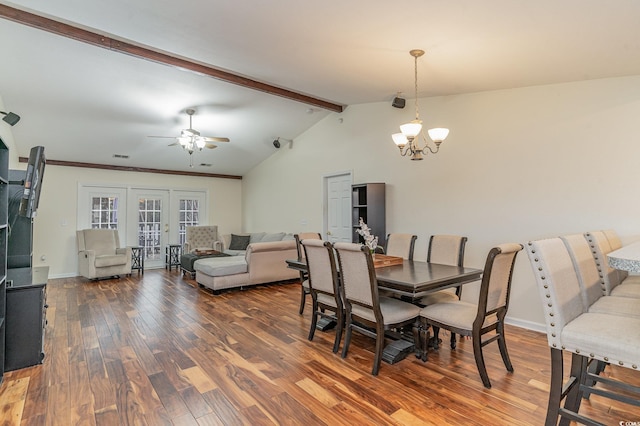 dining area with ceiling fan with notable chandelier, lofted ceiling with beams, and dark hardwood / wood-style flooring