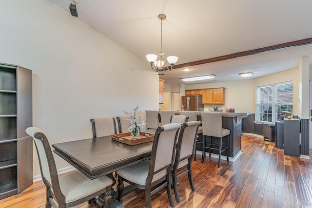 dining space featuring beamed ceiling, wood-type flooring, and an inviting chandelier