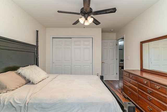 bedroom with dark hardwood / wood-style flooring and ceiling fan