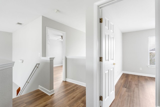 hall with hardwood / wood-style flooring