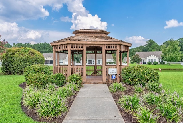 entrance to property featuring a lawn