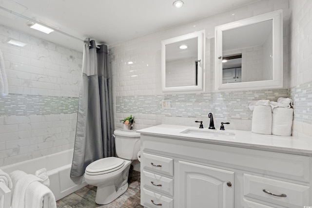 full bathroom featuring wood-type flooring, vanity, shower / tub combo with curtain, and backsplash