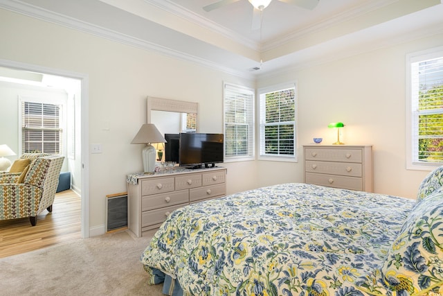 bedroom featuring light wood-type flooring, ceiling fan, and ornamental molding