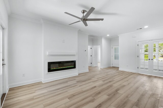 unfurnished living room featuring french doors, light wood-type flooring, ceiling fan, and crown molding