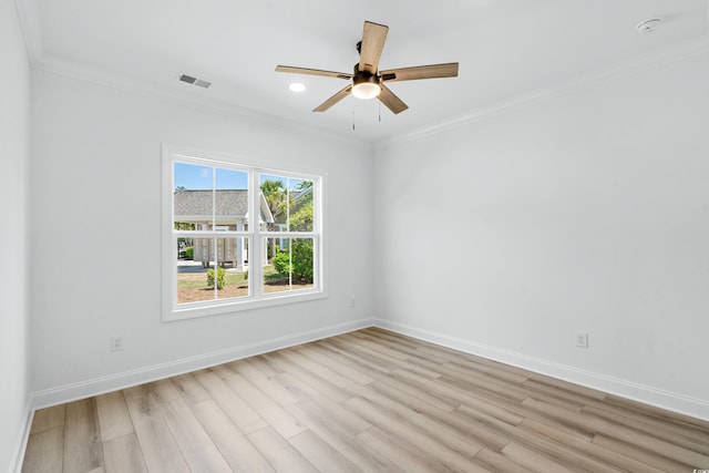 unfurnished room featuring ceiling fan, light hardwood / wood-style floors, and ornamental molding