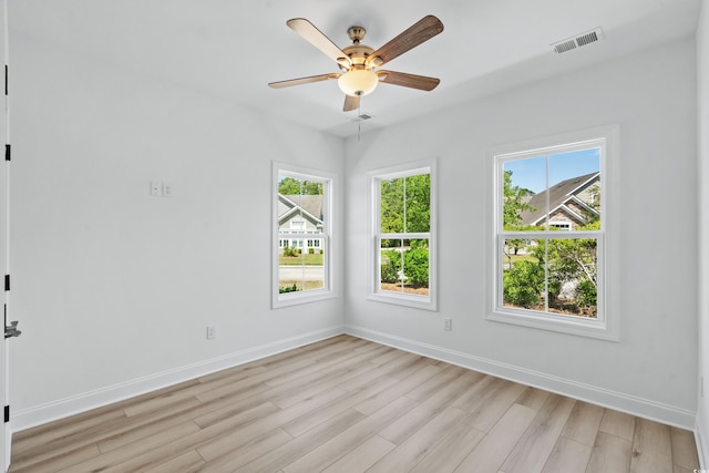 unfurnished room with ceiling fan and light hardwood / wood-style flooring