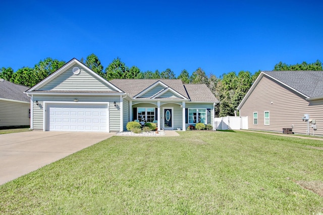 view of front of property featuring a garage and a front lawn