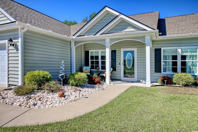 entrance to property featuring a yard